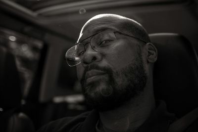 Portrait of bearded man in car