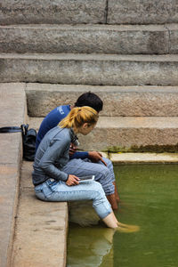 Woman sitting on steps