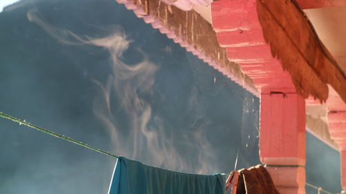 Panoramic view of multi colored flags hanging in lake