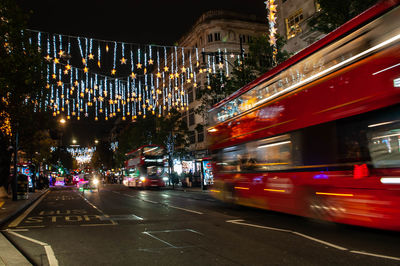 Illuminated city street at night
