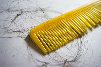 High angle view of yellow and coffee on table
