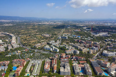 High angle view of buildings in city against sky