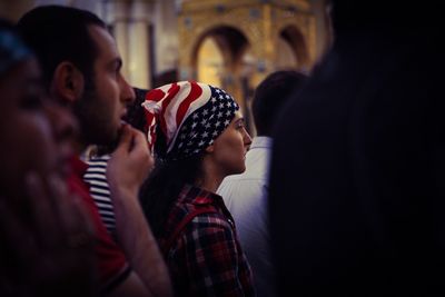 Close-up of young woman in crowd