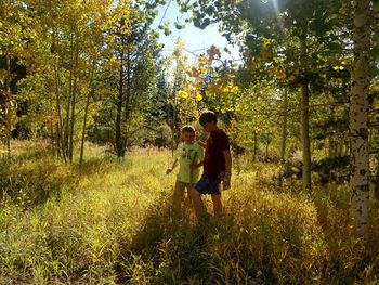 Young couple on road amidst trees