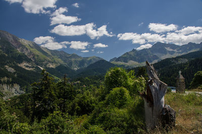 Scenic view of mountains against cloudy sky