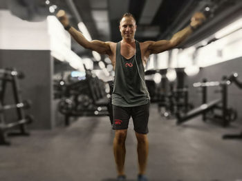 Full length of man with arms raised