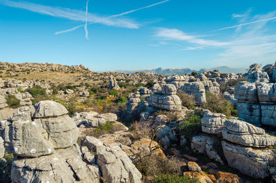 Panoramic view of landscape against blue sky