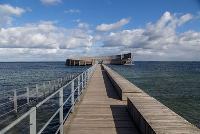 Pier over sea against sky