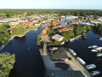 High angle view of river amidst buildings in a town