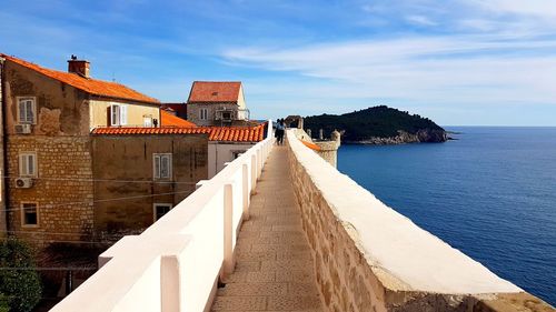 Panoramic view of sea and buildings against sky