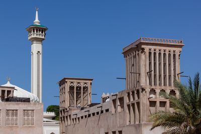 Low angle view of building against blue sky