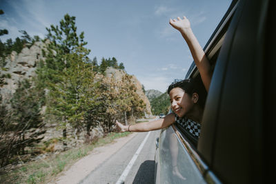 Cute girl peeking through car