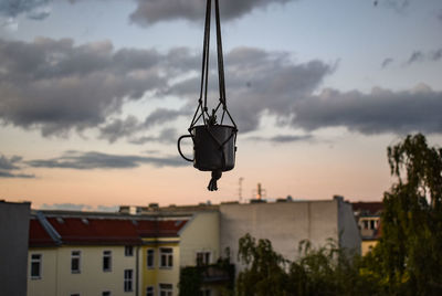 Low angle view of buildings against sky at sunset