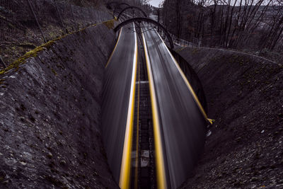 High angle view of light trails on road