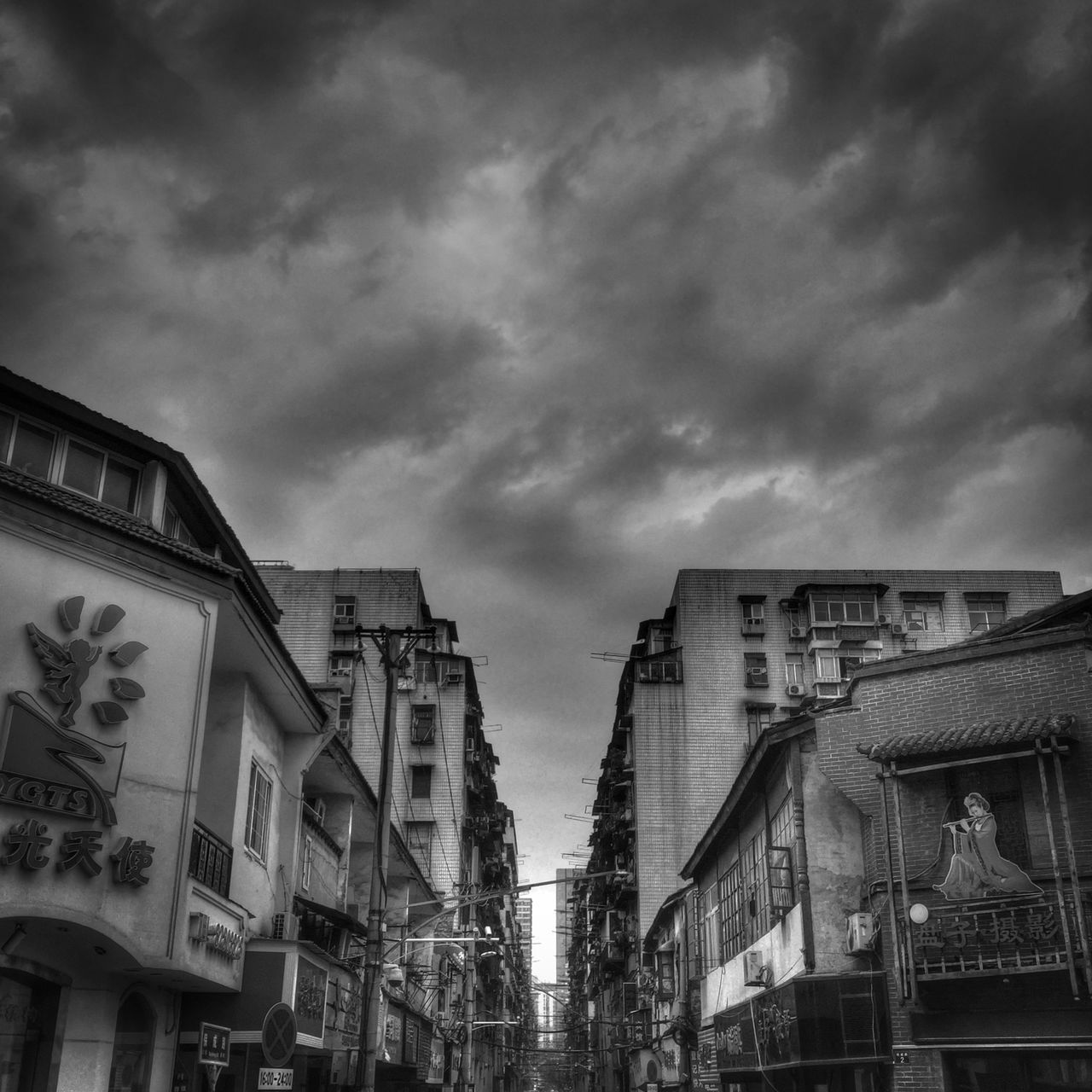 architecture, building exterior, built structure, sky, low angle view, cloud - sky, cloudy, building, residential structure, residential building, cloud, city, overcast, outdoors, window, house, weather, day, no people, high section