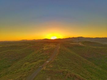 Scenic view of landscape against sky during sunset