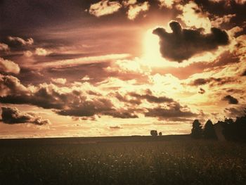 Scenic view of landscape against cloudy sky