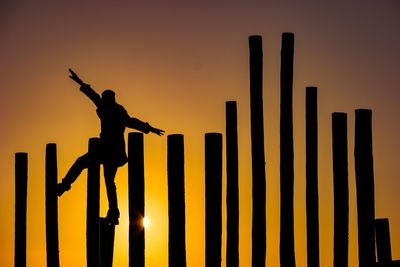 Silhouette man against sunset