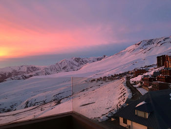 Scenic view of snow covered mountains against sky during winter