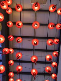 Low angle view of illuminated lanterns hanging on ceiling