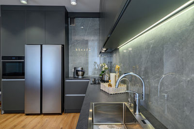 Interior of illuminated kitchen at home