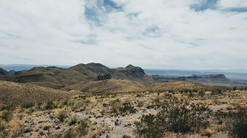 Scenic view of landscape against cloudy sky