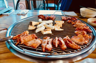 High angle view of meat on barbecue grill