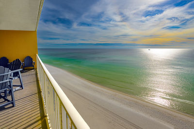 Scenic view of beach against sky during sunset