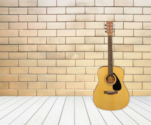 Guitar against wall