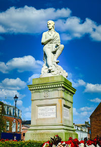 Low angle view of statue against sky