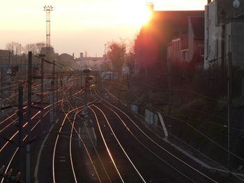 High angle view of railroad tracks against sky during sunset