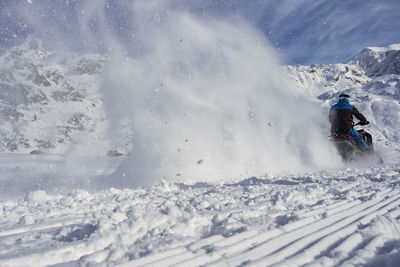 Man skiing on snow