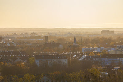 High angle view of illuminated cityscape against clear sky