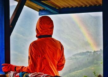 Low angle view of woman standing against sky