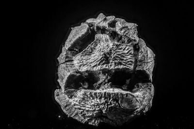 Digital composite image of rock against black background