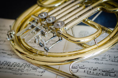 Close-up of trumpet on musical note