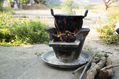 Old cooking pot stove using firewood as fuel.