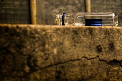 Close-up of bottle against wall