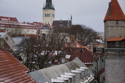Clock tower in city against clear sky