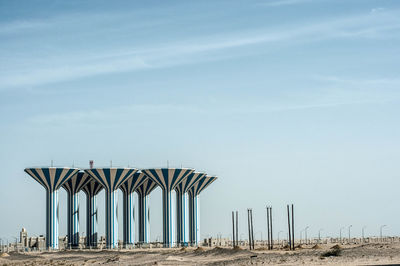 Built structure on beach against sky