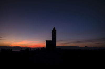 Silhouette of church building against sky during sunset in cabo de gata nature park, spain