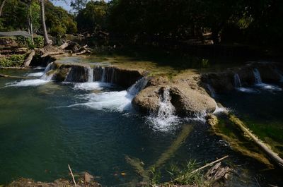 Scenic view of river flowing through rocks