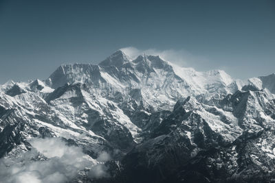 Scenic view of snowcapped mountains against clear sky