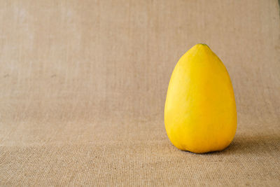 Close-up of yellow fruit on table