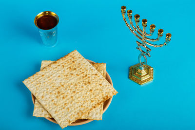 High angle view of drink on table against blue background