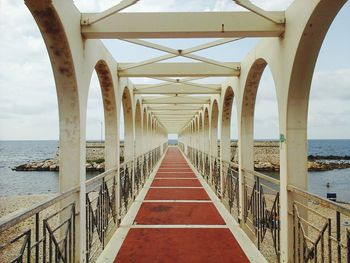 Pier over sea against sky