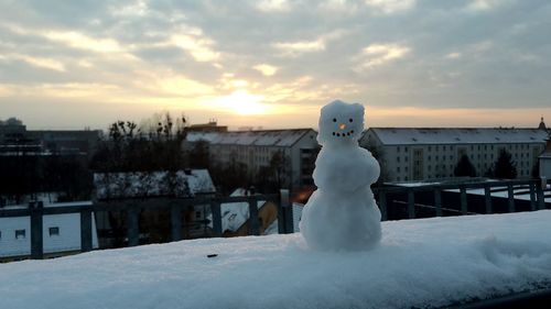 Snow covered landscape at sunset