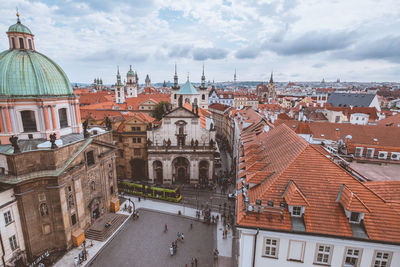 High angle view of buildings in city against sky