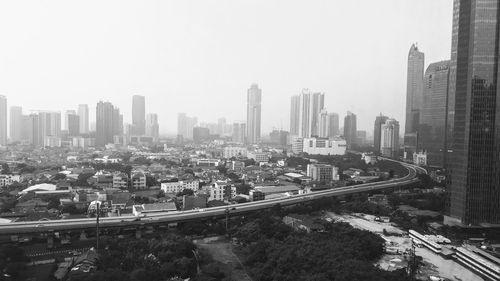 High angle view of buildings against clear sky