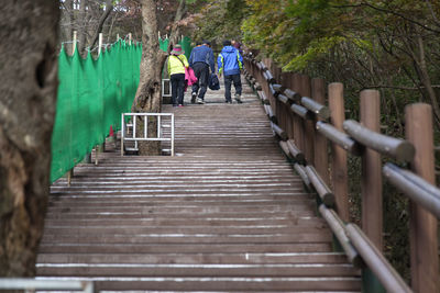 Low angle view of people walking on steps at maisan mountain